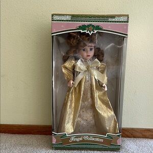 Gold porcelain doll from Angel Collections.